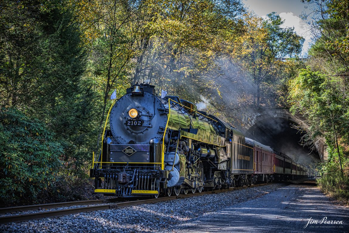 Reading & Northern's 2102 steam locomotive leads a passenger train towards Port Clinton, Pennsylvania, passing through Nesquehoning Tunnel on October 5th, 2024.

According to their website: The Reading Company T-1 class #2102 was built in the Reading’s own locomotive shops in 1945. With drivers of 70” diameter, it weighs 404 tons, and its tender holds up to 26 tons of coal, and up to 19,000 gallons of water. After the Reading Steam era was over, the Reading Company used 2102 for the Reading Rambles on several different excursions. The 2102 has had many different owners since it was retired by the Reading Railroad. It is one of only four to survive. The other remaining locomotives are the 2100, 2101, and 2124.

The Blue Mountain and Reading Railroad purchased the 2102 in 1987, and it ran on the Temple to South Hamburg line into the early 1990’s. Once the Blue Mountain and Reading Railroad became the Reading Blue Mountain & Northern, the 2102 ran over Reading & Northern’s rails for a short time before it was removed from service in the early 1990’s. 

In 2022, steam locomotive 2102 reentered service on the Reading & Northern. The locomotive has been used actively to pull both passenger excursions and revenue freight trains.

Tech Info: Nikon D810, RAW, Nikon 70-300 @ 70mm, f/4.5, 1400, ISO 800.

#steamtrains #besttrainphotograph #JimPearsonPhotography #RBNRR