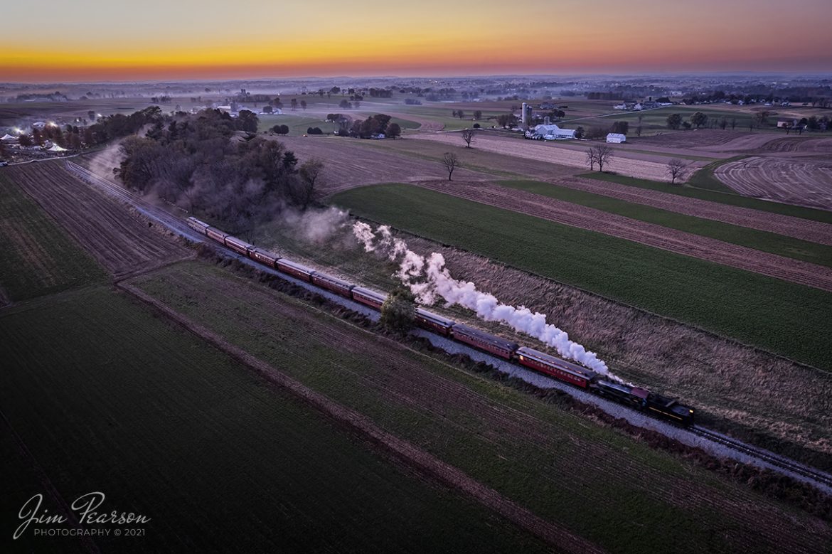 The last passenger train of the day departs eastbound at dusk after, pulling in reverse out of the depot at the Strasburg Railroad the last light of the day begins to fade. The cold November air produces a spectacular show of steam trailing along the train on November 6th, 2021, at Strasburg, Pennsylvania. Once they reach their turn around point down the line, they will reverse the locomotive at Leaman Place Junction in Paradise, PA, by running around the train and then make a normal pull back to the station.

According to Wikipedia: Strasburg Railroad (Norfolk and Western) No. 475 is a 4-8-0 "Mastodon" type steam locomotive owned and operated by the Strasburg Railroad outside of Strasburg, Pennsylvania. Built by the Baldwin Locomotive Works in June 1906, it was part of the Norfolk and Western's first order of M class numbered 375-499. Today, No. 475 is the only operating 4-8-0 type in North America and the Strasburg Rail Road's oldest operating steam locomotive.

Tech Info: DJI Mavic Air 2S Drone, RAW, 22mm, f/2.8, 1/15 sec, ISO 200.

#trainphotography #railroadphotography #trains #railways #dronephotography #trainphotographer #railroadphotographer #jimpearsonphotography