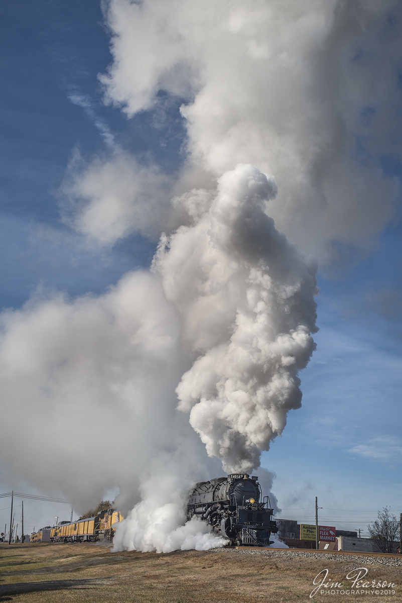 November 13, 2019 - Union Pacific's Race Across the Southwest was on the move again as UP 4014 Big Boy departs Prescott, Arkansas on its way north on the UP Little Rock Subdivision on a beautiful and cold fall morning. As you can tell the cold weather went a long way in producing beautiful plumes of steam!! 

Did you know: The Big Boy and its tender is only 100 feet shorter than a Boeing 747! It takes a sedan, a school bus, and a diesel engine to match the length of the Big Boy and its tender. With a height of 16 feet 4 inches, and a length of 132 feet, it falls short of the 232 foot Boeing 747 only by 100 feet!

Tech Info: Nikon D800, RAW, Sigma 24-70 @48mm, f/8, 1/1000, ISO 125.

#trainphotography #railroadphotography #trains #railways #trainphotographer #railroadphotographer #jimpearsonphotography  #unionpacificbigboy #up4014 #steamtrain