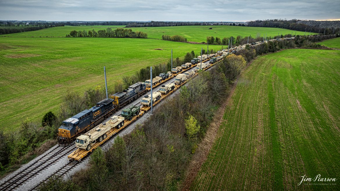 CSX S710 hooks up to their first string of military equipment on the Fort Campbell Wye from Fort Campbell, Kentucky, on the CSX Henderson Subdivision at Hopkinsville, Kentucky on November15th, 2024.

Tech Info: DJI Mavic 3 Classic Drone, RAW, 24mm, f/2.8, 1/100, ISO 120.

#militarytrain #besttrainphotograph #bestphoto #photographyoftrains #bestsoldpicture #JimPearsonPhotography