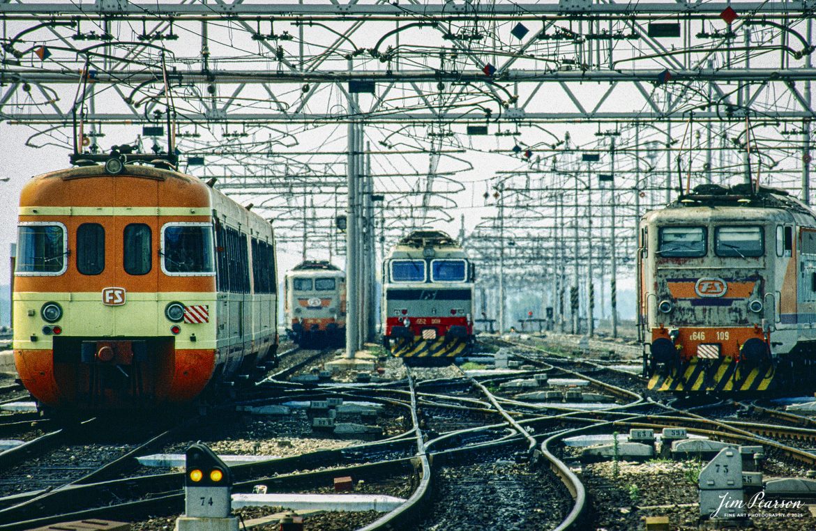 Film Wednesday – 1993 – Today’s scanned slides were all taken at various places during the time I was deployed during (from Wikipedia) “Operation Deny Flight which was a North Atlantic Treaty Organization (NATO) operation that began on 12 April 1993 as the enforcement of a United Nations (UN) no-fly zone over Bosnia and Herzegovina.”

This is a shot of a shot looking at power out in the yard from the station at Milan, Italy.

“The United Nations and NATO later expanded the mission of the operation to include providing close air support for UN troops in Bosnia and carrying out coercive air strikes against targets in Bosnia. Twelve NATO members contributed forces to the operation and, by its end on 20 December 1995, NATO pilots had flown 100,420 sorties.”

Also from Wikipedia: We were also part of “Operation Provide Hope which was a humanitarian operation conducted by the U.S. Air Force starting in 1992 to provide medical equipment to former Soviet republics during their transition to freedom from the USSR until 1994.

The operation was announced by Secretary of State James A. Baker, III on January 22–23, 1992 and the initial shipment of supplies was sent on February 10, 1992. Twelve US Air Force C-5 and C-141 was carrying an estimated 500 tons of bulk-food rations and medicines into Moscow, Saint Petersburg, Kyiv, Minsk, and Chișinău from Germany and Yerevan, Almaty, Dushanbe, Ashkhabad, Baku, Tashkent, and Bishkek from Turkey. In total, for nearly two weeks sixty-five missions flew 2,363 short tons (2,144 t) of food and medical supplies to 24 locations in the Commonwealth of Independent States during the initial phase of operation. Much of these supplies were left over from the buildup to the Persian Gulf War.”

For 6-months of this operation I was the photo editor for a Combat Camera team that worked out of Aviano, Italy covering both operations. On the weekends, our schedules allowed us some time to travel and on my days off I traveled and today’s photos, along with many others.

Tech Info: Camera, Nikon F3, Ektachrome Slide Film, no other data recorded, Scanned with an Epson Perfection V700 PHOTO scanner.

#slidescan #filmphotography #trains #railroads #jimpearsonphotography #FilmPhotography