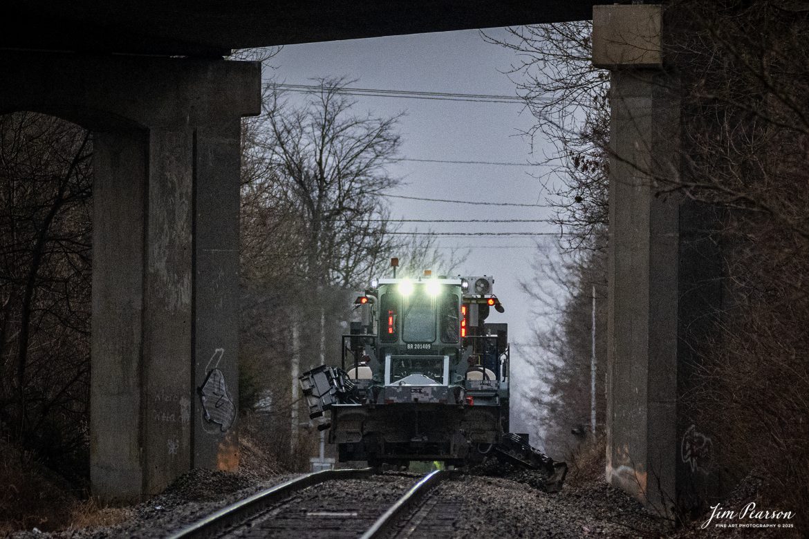 CSX ballast regulator BR 201409, with a digital camo paint scheme, works under the north main street overpass at Madisonville, Ky on January 30th, 2025, on the CSX Henderson Subdivision. 

Tech Info: Nikon Z30, RAW, Sigma 150-600 @ 320mm, f/5.6, 1/2500, ISO 2800.

#railroad #railroads #train, #trains #railway #railway  #besttrainphotograph #bestphoto #photographyoftrains #bestsoldpicture #JimPearsonPhotography #csxt #onecsx