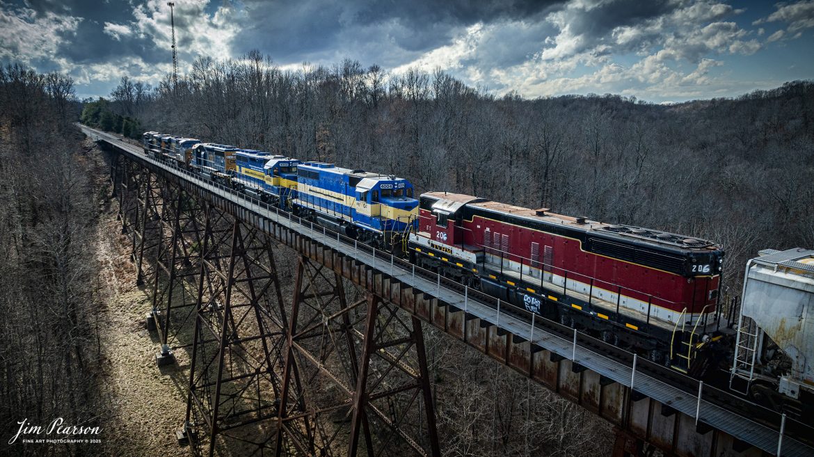 CSX M513 makes their way south across Gum Lick Trestle, between Crofton and Kelly, Kentucky, on January 31st, 2025, on the CSX Henderson Subdivision, with several interesting locomotives in tow.

Bringing up the rear is Tennessee Valley Railroad Museum 206, then ex-Dakota and Eastern 4004 (AR404) and 4002 (AR4002) and CSXT 8243, which had damage on the engineer’s side, which you can’t see in this photo. They were all dead in tow behind two other CSX units.

Tech Info: DJI Mavic 3 Classic Drone, RAW, 24mm, f/2.8, 1/1250, ISO 270.

#bestphoto #trains #bestsoldpicture #JimPearsonPhotography #trainsfromtheair #trainsfromadrone