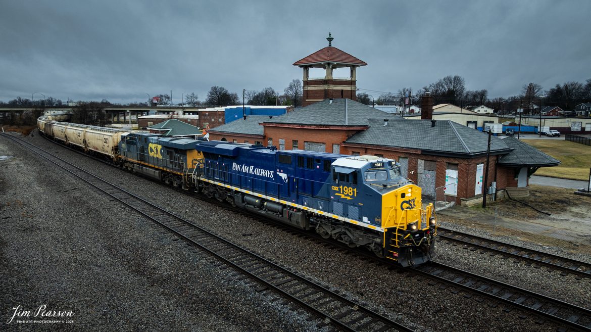 CSXT 1981 PanAm Railway Heritage Unit leads G342 northbound, under stormy skies, as it passes the old Louisville and Nashville Railway Depot at Henderson, on February 15th, 2025, on the CSX Henderson Subdivision.

According to a CSXT Press Release: November 25, 2024 - CSX has unveiled locomotive No. 1981, the final installment in its series of heritage locomotives, honoring Pan Am Railways. The unit is the 21st and final creation by the Waycross Paint Shop to celebrate the predecessor railroads that form today’s CSX network.

Pan Am Railways, formerly known as Guilford Transportation, was established in 1981 and operated across northern New England, spanning from Maine to New York. It joined the CSX family in 2022 following a purchase agreement.

All 21 heritage units are not just displays of craftsmanship but active locomotives performing daily duties throughout CSX’s 26-state rail network. The dedication behind their creation reflects the artistry of the team at the Waycross Paint Shop.

“I've been involved in all of the 21 units,” said CSX carman painter Clyde Marshall. “The work itself has really been enjoyable. The transformation of the units, from when they first arrive in the shop to the finished product, is very rewarding.

Marshall also noted the significance of connecting with railroad history through these projects. “It is an honor to learn about the history of these units, and the importance the railroad played in American history,” he added.

The completion of locomotive No. 1981 stands as a tribute to the history of Pan Am Railways and the pride shared by CSX employees. As CSX approaches its 200th anniversary in 2027, these heritage locomotives symbolize the company’s enduring legacy and its dedication to innovation and service.

Tech Info: DJI Mavic 3 Classic Drone, RAW, 24mm, f/2.8, 1/500, ISO 170

#railroad #railroads #train, #trains #railway #railway #railtransport #railroadengines #picturesoftrains #picturesofrailways #besttrainphotograph #bestphoto #onecsx #photographyoftrains #bestsoldpicture #JimPearsonPhotography #trainsfromadrone #csxheritageunit