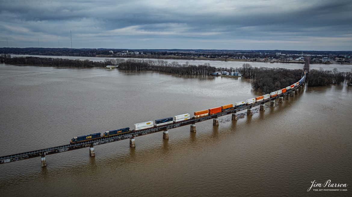 CSX Hot intermodal I128 heads north from Henderson, Kentucky as it crosses over the bridge over the Ohio River, which has overflowed its banks into the floodplain due to the recent rainfall and snow melt, as they head north on the CSX Henderson Subdivision on February 24th, 2025. 

Tech Info: DJI Mavic 3 Classic Drone, RAW, 22mm, f/2.8, 1/1250, ISO 100.

#railroad #railroads #train, #trains #railway #railway #railtransport #railroadengines #picturesoftrains #picturesofrailways #besttrainphotograph #bestphoto #photographyoftrains #bestsoldpicture #JimPearsonPhotography #trainsfromadrone #flooding #csxhendersonsubdivision #onecsx