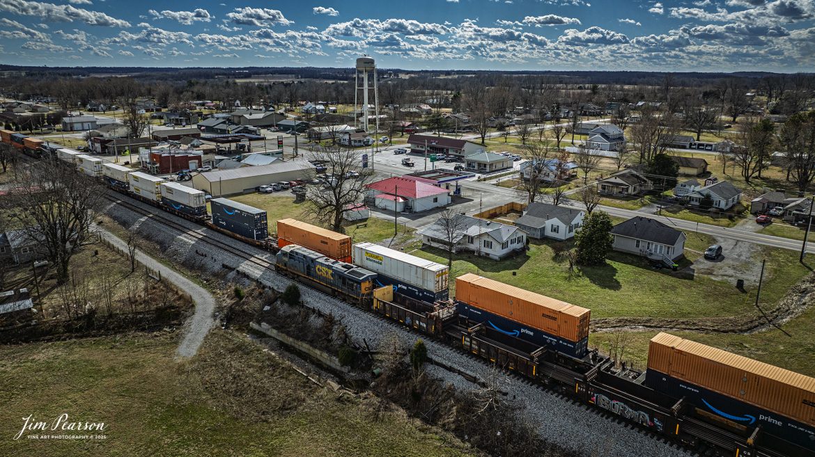 CSX loaded rail train W471, being led by CSXT 5403, waits in the siding at Crofton, Kentucky as CSX hot intermodal, I128, heads north on the main, on the CSX Henerson Subdivision on February 27th, 2025. 

Tech Info: DJI Mavic 3 Classic Drone, RAW, 22mm, f/2.8, 1/4000, ISO 180.

#railroad #railroads #train, #trains #railway #railway #railtransport #railroadengines #picturesoftrains #picturesofrailways #besttrainphotograph #bestphoto #photographyoftrains #bestsoldpicture #JimPearsonPhotography #trainsfromadrone #flooding #csxhendersonsubdivision #onecsx