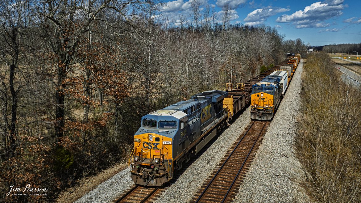 CSXT 3122 leads M647 as it passes loaded rail train W471, being led by CSXT 5403 at Romney, Nortonville, Kentucky as they both make their way south on the CSX Henderson Subdivision on February 27th, 2025. Once passed, the rail train continued their work of dropping rail between Romney and Crofton, Ky.

Tech Info: DJI Mavic 3 Classic Drone, RAW, 22mm, f/2.8, 1/2000, ISO 100.

#railroad #railroads #train, #trains #railway #railway #railtransport #railroadengines #picturesoftrains #picturesofrailways #besttrainphotograph #bestphoto #photographyoftrains #bestsoldpicture #JimPearsonPhotography #trainsfromadrone #flooding #csxhendersonsubdivision #onecsx