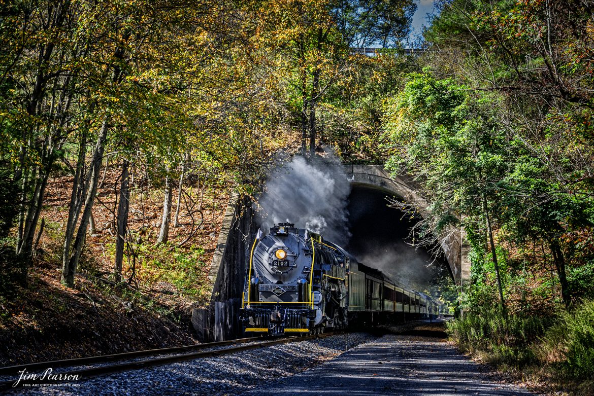 Reading & Northern's 2102 steam locomotive leads a passenger train towards Port Clinton, Pennsylvania, passing through Nesquehoning Tunnel on October 5th, 2024.

According to their website: The Reading Company T-1 class #2102 was built in the Reading’s own locomotive shops in 1945. With drivers of 70” diameter, it weighs 404 tons, and its tender holds up to 26 tons of coal, and up to 19,000 gallons of water. After the Reading Steam era was over, the Reading Company used 2102 for the Reading Rambles on several different excursions. The 2102 has had many different owners since it was retired by the Reading Railroad. It is one of only four to survive. The other remaining locomotives are the 2100, 2101, and 2124.

The Blue Mountain and Reading Railroad purchased the 2102 in 1987, and it ran on the Temple to South Hamburg line into the early 1990’s. Once the Blue Mountain and Reading Railroad became the Reading Blue Mountain & Northern, the 2102 ran over Reading & Northern’s rails for a short time before it was removed from service in the early 1990’s. 

In 2022, steam locomotive 2102 reentered service on the Reading & Northern. The locomotive has been used actively to pull both passenger excursions and revenue freight trains.

Tech Info: Nikon D810, RAW, Nikon 70-300 @ 70mm, f/4.5, 1400, ISO 450.

#steamtrains #besttrainphotograph #JimPearsonPhotography #RBNRR