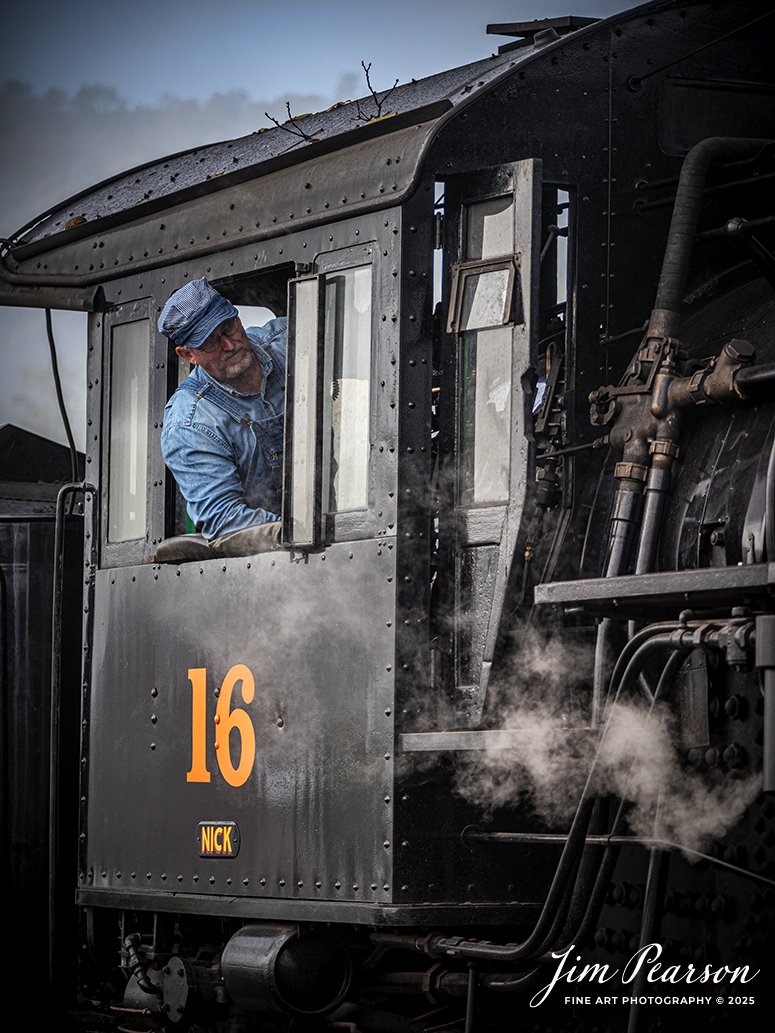 East Broad Top (EBT) steam locomotive #16 pulls a mixed freight as the engineer keeps an eye on the track ahead, as they head through the yard at Rockhill Furnace, Pennsylvania on October 6th, 2024, during the museum’s Friends of the East Broad top event.

According to the East Broad Top Website: Locomotive #16 was built in 1916 by the Baldwin Locomotive Works.

Entering the age of modern steam in 1916, the EBT received its first of three large Mikados. Unlike the previous three smaller locomotives, #16 came with superheaters, piston valves, and Southern valve gear. One story mentions #16 pulled 60 empty hoppers from Mt. Union to Rockhill in one train, literally clearing out the yard. #16 underwent an overhaul in 1955 and made only a handful of trips in early 1956 before the railroad shut down. On February 1, 2023, the locomotive returned to service.

Tech Info: Nikon D810, RAW, Nikon 70-300 @140mm, f/5, 1/640, ISO 500.

steam locomotive, train, railways, vintage, smoke, green hillside, sunlight, iron bridge, transportation, travel, photography of trains, train photography, Jim Pearson Photography, trending photo, East Broad Top Railroad, steam train