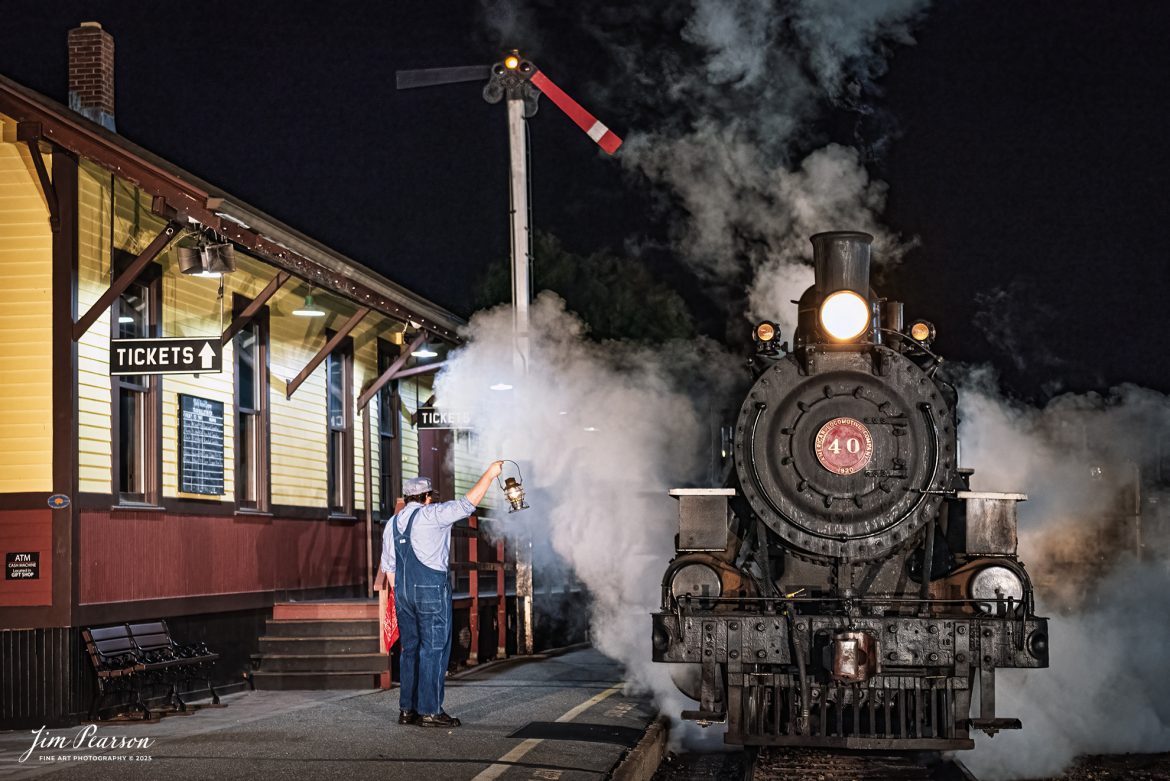 A brakeman holds up a lantern at the depot next to The Valley Railroad Company #40 during a night photo shoot at Essex, Connecticut, on October 8th, 2024, during a photo charter conducted by Dak Dillion Photography.

According to Wikipedia: The Valley Railroad, operating under the name Essex Steam Train and Riverboat, is a heritage railroad based in Connecticut on tracks of the Connecticut Valley Railroad, which was founded in 1868. The company began operations in 1971 between Deep River and Essex and has since reopened additional parts of the former Connecticut Valley Railroad line. It operates the Essex Steam Train and the Essex Clipper Dinner Train.

Tech Info: Nikon D810, RAW, Nikon 24-70 @ 58mm, 2.8, 1/100, ISO 5,600.

#photographyoftrains #bestsoldpicture #JimPearsonPhotography #thevalleyrailroad #steamtrains