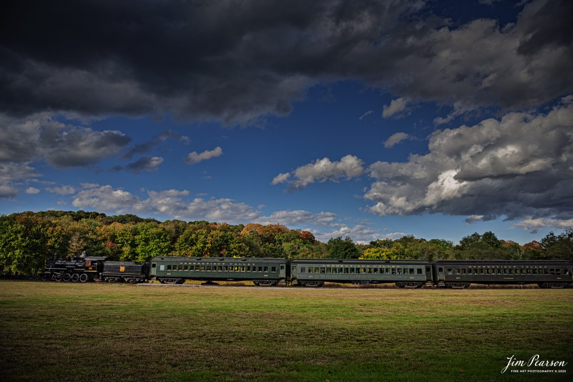 The Valley Railroad Company #97  pulls across an open field just outside Essex, Connecticut with a passenger train on October 9th, 2024, as part of a two-day photo charter conducted by Dak Dillion Photography.

According to Wikipedia: The Valley Railroad, operating under the name Essex Steam Train and Riverboat, is a heritage railroad based in Connecticut on tracks of the Connecticut Valley Railroad, which was founded in 1868. The company began operations in 1971 between Deep River and Essex and has since reopened additional parts of the former Connecticut Valley Railroad line. It operates the Essex Steam Train and the Essex Clipper Dinner Train.

Tech Info: Nikon D810, RAW, Nikon 24-70 @ 24mm, f/2.8, 1/2000, ISO 90.

#photographyoftrains #trainphotography #JimPearsonPhotography #trendingphoto #thevalleyroadcompany