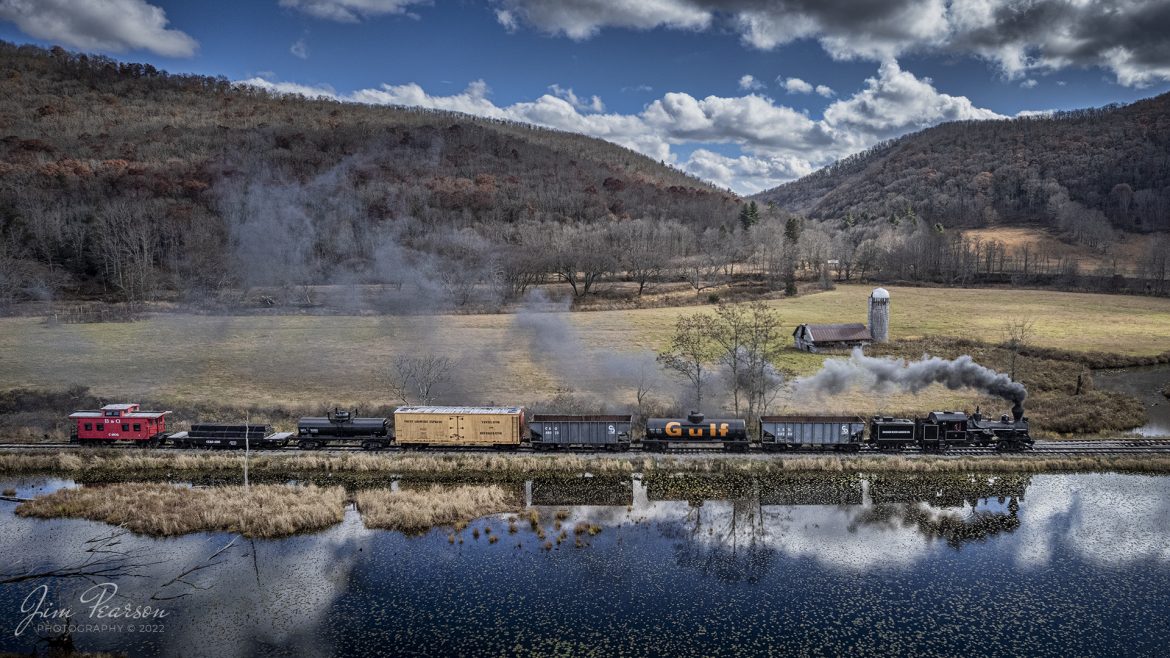 Meadow River Lumber Company steam locomotive, Heisler No. 6, leads a freight train past a wetlands area at Hosterman, West Virginia during the Mountain Rail WV, Rail Heritage Photography Weekend. The event was held at the Durbin & Greenbrier Valley Railroad, Durbin, WV, and Cass Scenic Railroad, Cass, WV, from November 4-6th, 2022. 

According to Wikipedia: The Durbin and Greenbrier Valley Railroad (reporting mark DGVR) is a heritage and freight railroad in the U.S. states of Virginia and West Virginia. It operates the West Virginia State Rail Authority-owned Durbin Railroad and West Virginia Central Railroad (reporting mark WVC), as well as the Shenandoah Valley Railroad in Virginia.

Beginning in 2015, DGVR began operating the historic geared steam-powered Cass Scenic Railroad, which was previously operated by the West Virginia Division of Natural Resources as part of Cass Scenic Railroad State Park.

Tech Info: DJI Mavic Air 2S Drone, 22mm, f/2.8, 1/2000, ISO 100.

#trainphotography #railroadphotography #trains #railways #dronephotography #trainphotographer #railroadphotographer #jimpearsonphotography #cassscenicrailway #durbinandgreenbriervalleyrr #trainsfromtheair	#steamtrains