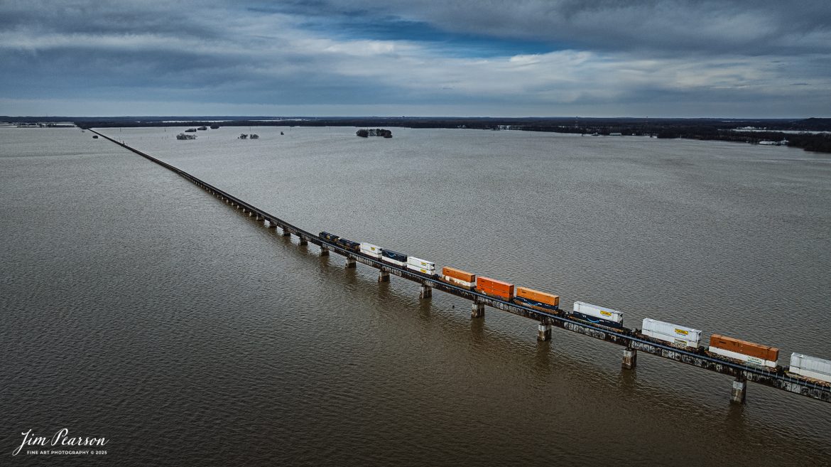 CSX Hot intermodal I128 heads north at Rahm, Indiana as it heads into Evansville, Indiana on their way to Chicago, IL. The Ohio River, overflowed its banks into the floodplain due to the recent rainfall and snow melt, on the CSX Henderson Subdivision on February 24th, 2025. 

Tech Info: DJI Mavic 3 Classic Drone, RAW, 22mm, f/2.8, 1/1250, ISO 100.

#railroad #railroads #train, #trains #railway #railway #railtransport #railroadengines #picturesoftrains #picturesofrailways #besttrainphotograph #bestphoto #photographyoftrains #bestsoldpicture #JimPearsonPhotography #trainsfromadrone #flooding #csxhendersonsubdivision #onecsx