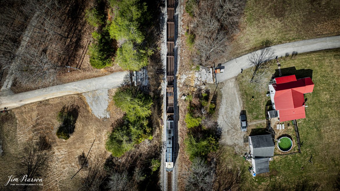 CSX loaded rail train W471 pulls slowly while dropping rail as they pass the site where the last wooden bridge was located on the CSX Henderson Subdivision on Davis Road, north of Crofton, Kentucky on February 27th, 2025. CSX built a new road for residents to access their homes on the right side of this shot and have since torn down the old wooden bridge that used to cross over the tracks at this location. 

Tech Info: DJI Mavic 3 Classic Drone, RAW, 22mm, f/2.8, 1/1250, ISO 100.

#railroad #railroads #train, #trains #railway #railway #railtransport #railroadengines #picturesoftrains #picturesofrailways #besttrainphotograph #bestphoto #photographyoftrains #bestsoldpicture #JimPearsonPhotography #trainsfromadrone #flooding #csxhendersonsubdivision #onecsx