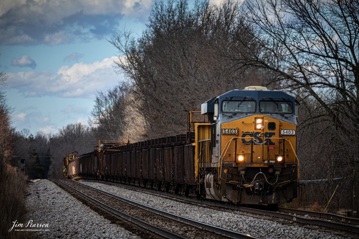 CSX loaded rail train W471, being led by CSXT 5403, waits in the siding at Crofton, Kentucky for northbound CSX hot intermodal, I128, on the CSX Henderson Subdivision on February 27th, 2025. 

Tech Info: DJI Mavic 3 Classic Drone, RAW, 22mm, f/2.8, 1/1000, ISO 400.

#railroad #railroads #train, #trains #railway #railway #railtransport #railroadengines #picturesoftrains #picturesofrailways #besttrainphotograph #bestphoto #photographyoftrains #bestsoldpicture #JimPearsonPhotography #trainsfromadrone #flooding #csxhendersonsubdivision #onecsx